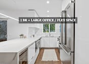Thumbnail 1 of 85 - A modern kitchen with a large island and stainless steel appliances.