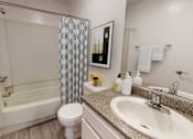 Thumbnail 18 of 29 - a bathroom with a sink and a toilet and a shower