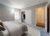 Thumbnail 17 of 29 - a bedroom with a bed and a closet