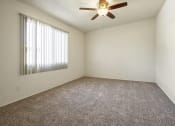 Thumbnail 23 of 48 - Bedroom with ceiling fan and carpeted flooring