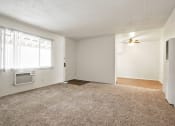 Thumbnail 18 of 48 - Living room with air conditioning, carpeted flooring , ceiling fan in dining area