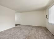 Thumbnail 15 of 48 - Living room with carpeted floors