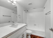 Thumbnail 15 of 39 - a bathroom with a sink toilet and shower