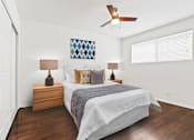 Thumbnail 15 of 31 - a bedroom with a bed and a ceiling fan