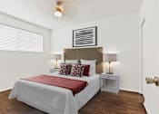 Thumbnail 17 of 31 - a bedroom with a bed and two nightstands