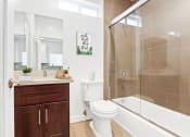 Thumbnail 10 of 32 - a bathroom with a toilet sink and bathtub