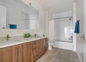 Thumbnail 19 of 26 - a bathroom with a sink and a toilet