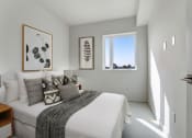 Thumbnail 20 of 26 - a bedroom with a large bed in a room