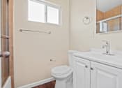 Thumbnail 12 of 48 - a bathroom with a toilet sink and shower