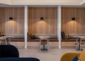 Thumbnail 7 of 15 - a restaurant with wooden walls and tables and chairs