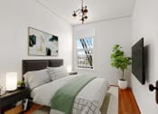 Thumbnail 4 of 10 - a bedroom with a bed and a large window