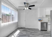 Thumbnail 27 of 66 - a kitchen with a ceiling fan and a window