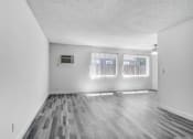 Thumbnail 23 of 66 - an empty living room with three windows