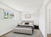 Thumbnail 41 of 81 - A bedroom with a large bed and a framed picture on the wall.