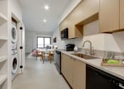Thumbnail 1 of 38 - a kitchen and dining area in a 555 waverly unit