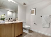 Thumbnail 28 of 38 - a bathroom with a toilet sink and mirror