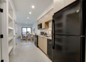 Thumbnail 29 of 38 - a kitchen and dining area in a 555 waverly unit
