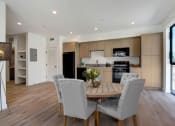 Thumbnail 7 of 38 - a kitchen and dining area in a 555 waverly unit