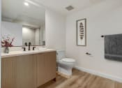 Thumbnail 8 of 38 - a bathroom with a toilet sink and mirror