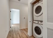 Thumbnail 18 of 38 - a washer and dryer in a laundry room