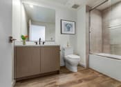Thumbnail 22 of 38 - a bathroom with a toilet sink and shower