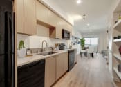 Thumbnail 9 of 38 - a kitchen and dining area in a 555 waverly unit