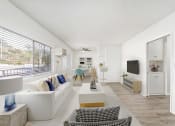 Thumbnail 12 of 24 - a living room with white furniture and a large window