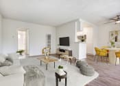 Thumbnail 6 of 24 - the living room of an apartment with a couch and a table