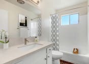 Thumbnail 8 of 24 - a bathroom with a sink toilet and a shower