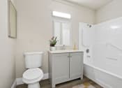 Thumbnail 18 of 52 - a bathroom with a toilet sink and bathtub