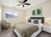 Thumbnail 17 of 52 - a bedroom with a bed and a ceiling fan