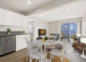 Thumbnail 14 of 52 - a kitchen and dining area in a 555 waverly unit