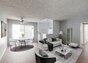 Thumbnail 2 of 5 - A living room with a white couch, a coffee table, and a painting on the wall.