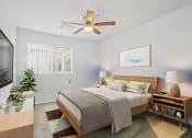 Thumbnail 7 of 52 - a bedroom with a large bed and a ceiling fan