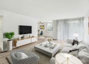 Thumbnail 2 of 19 - a living room with a couch and a coffee table