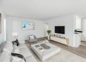 Thumbnail 3 of 19 - a living room with a white couch and a coffee table