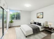 Thumbnail 5 of 19 - a white bedroom with a bed and a sliding glass door
