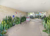 Thumbnail 60 of 66 - the entrance to a building with plants in front of it