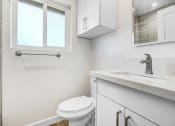 Thumbnail 48 of 66 - an empty bathroom with a toilet and a sink