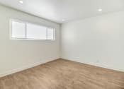 Thumbnail 39 of 66 - an empty room with white walls and a window