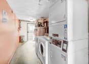 Thumbnail 66 of 66 - a laundry room with a washer and a dryer in it