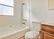 Thumbnail 4 of 11 - Bathroom With Tub and Shower Combo, Wood Style Flooring