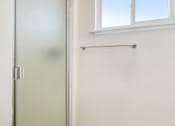 Thumbnail 50 of 79 - A white door is on the left and a white wall is on the right.