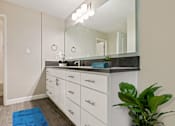 Thumbnail 25 of 76 - Single long gray countertops vanity  with mirror track lighting