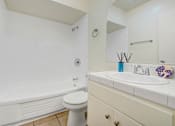 Thumbnail 34 of 48 - a bathroom with a sink toilet and a bath tub