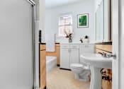 Thumbnail 2 of 8 - a bathroom with a sink toilet and a bath tub