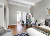 Thumbnail 1 of 17 - Efficiency no Full Kitchen, White refrigerator and microwave, wood-inspired floors sleeping and dining area