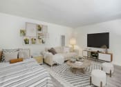 Thumbnail 20 of 83 - a living room with a couch and a tv