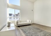 Thumbnail 36 of 42 - Living and sleeping area of a studio penthouse, large windows, high ceilings, Laminate flooring