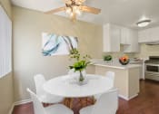 Thumbnail 3 of 22 - Dining area with ceiliing fan and kitchen on the right